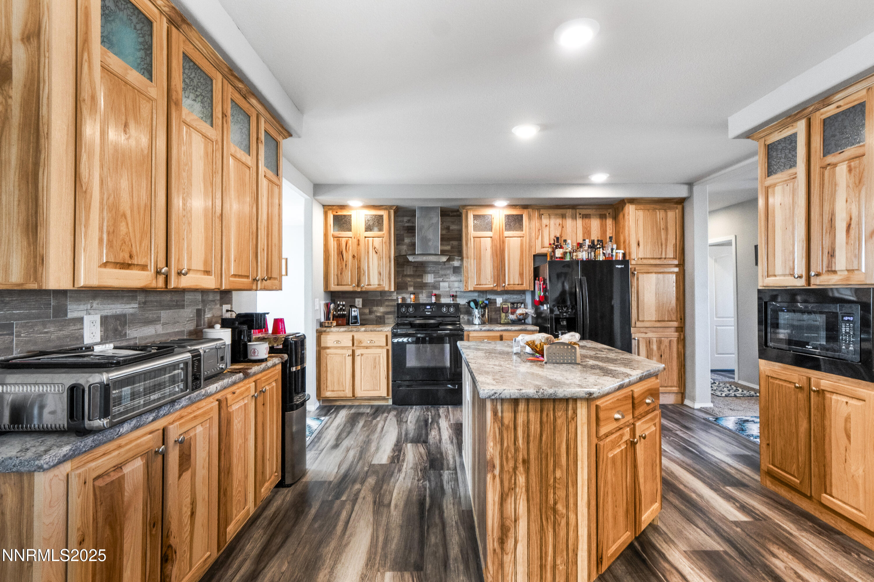 6745 Country Road Winnemucca, NV 89445 - Photo 10 of 50 a kitchen with stainless steel appliances granite countertop sink stove top oven and cabinets