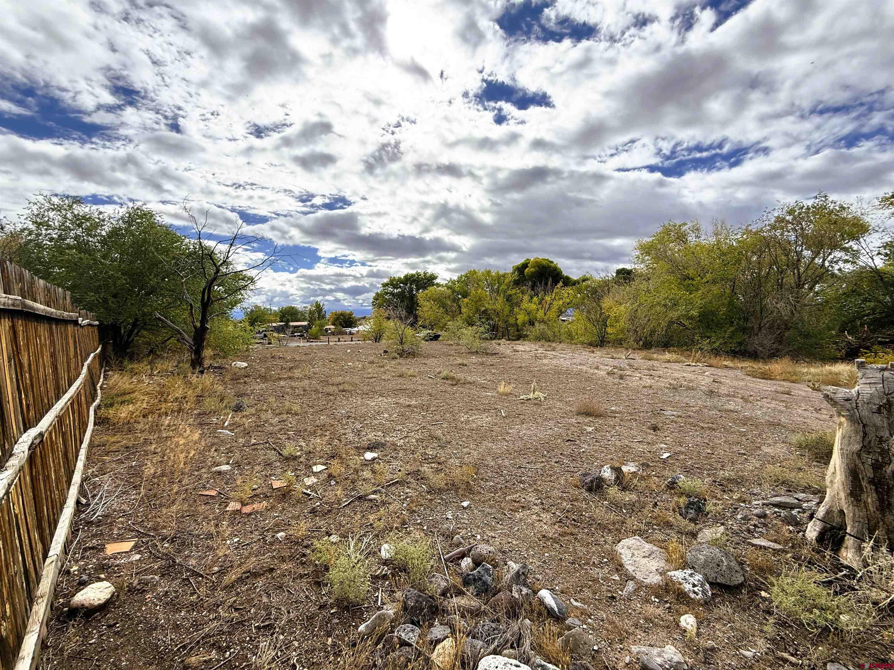 Tbd Tbd Fairview (2007 Rd) Road Austin, CO 81410 - Photo 4 of 6 a view of a yard with wooden fence