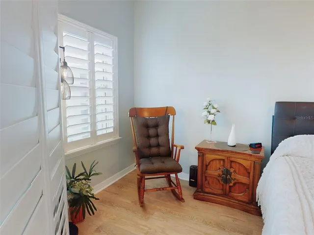 a bathroom with a double vanity sink and mirror with toilet