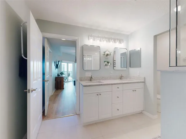 a utility room with cabinets dryer and washer