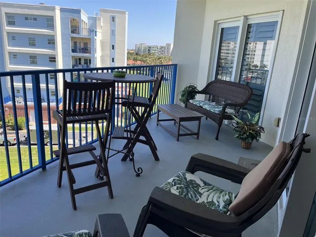 a view of a balcony with chairs