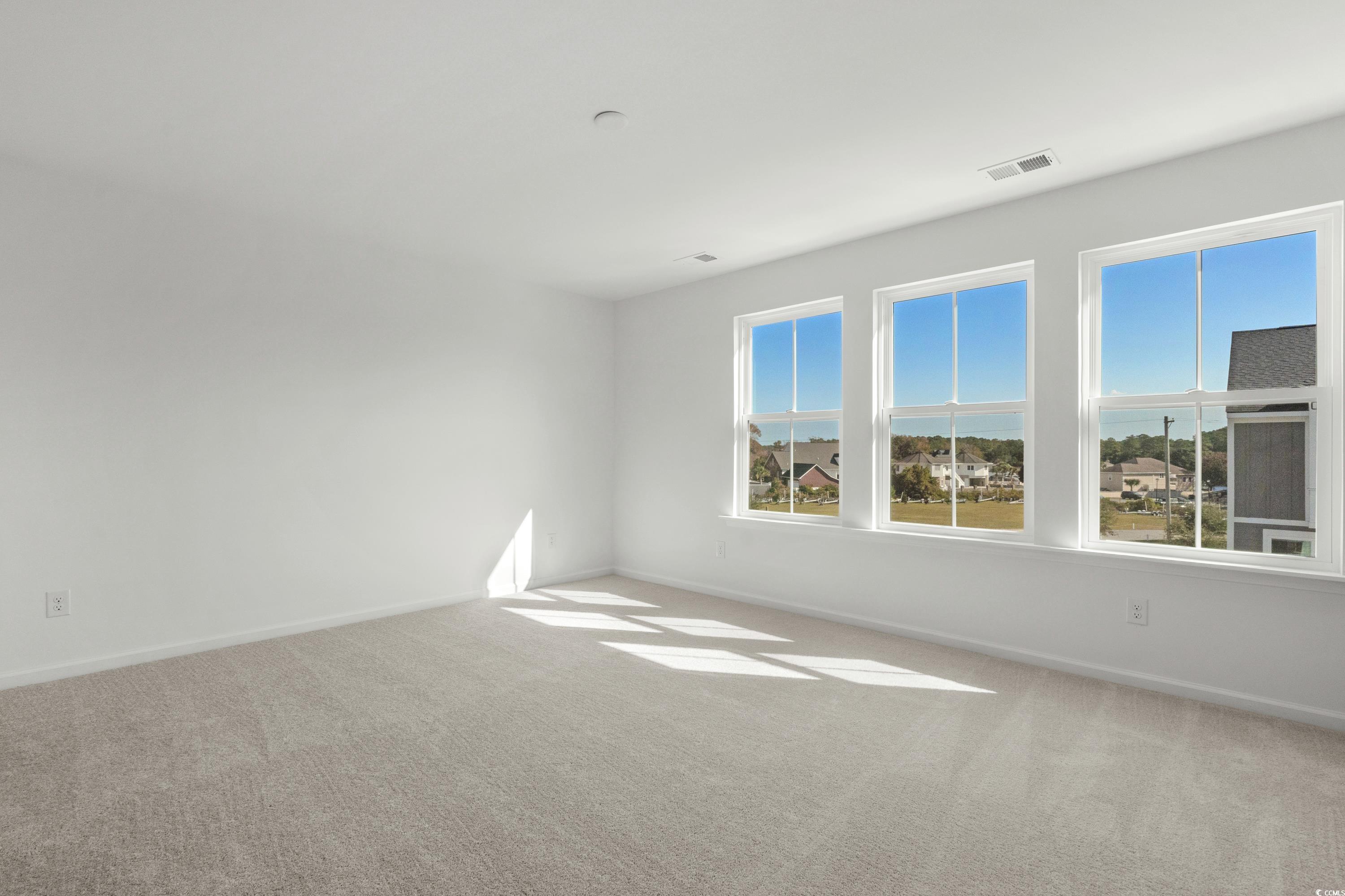 4414 Kingsport Road, Unit 1502 Little River, SC 29566 - Photo 33 of 33 Kitchen featuring open floor plan, an island with sink, stainless steel appliances, white cabinetry, and light wood finished floors