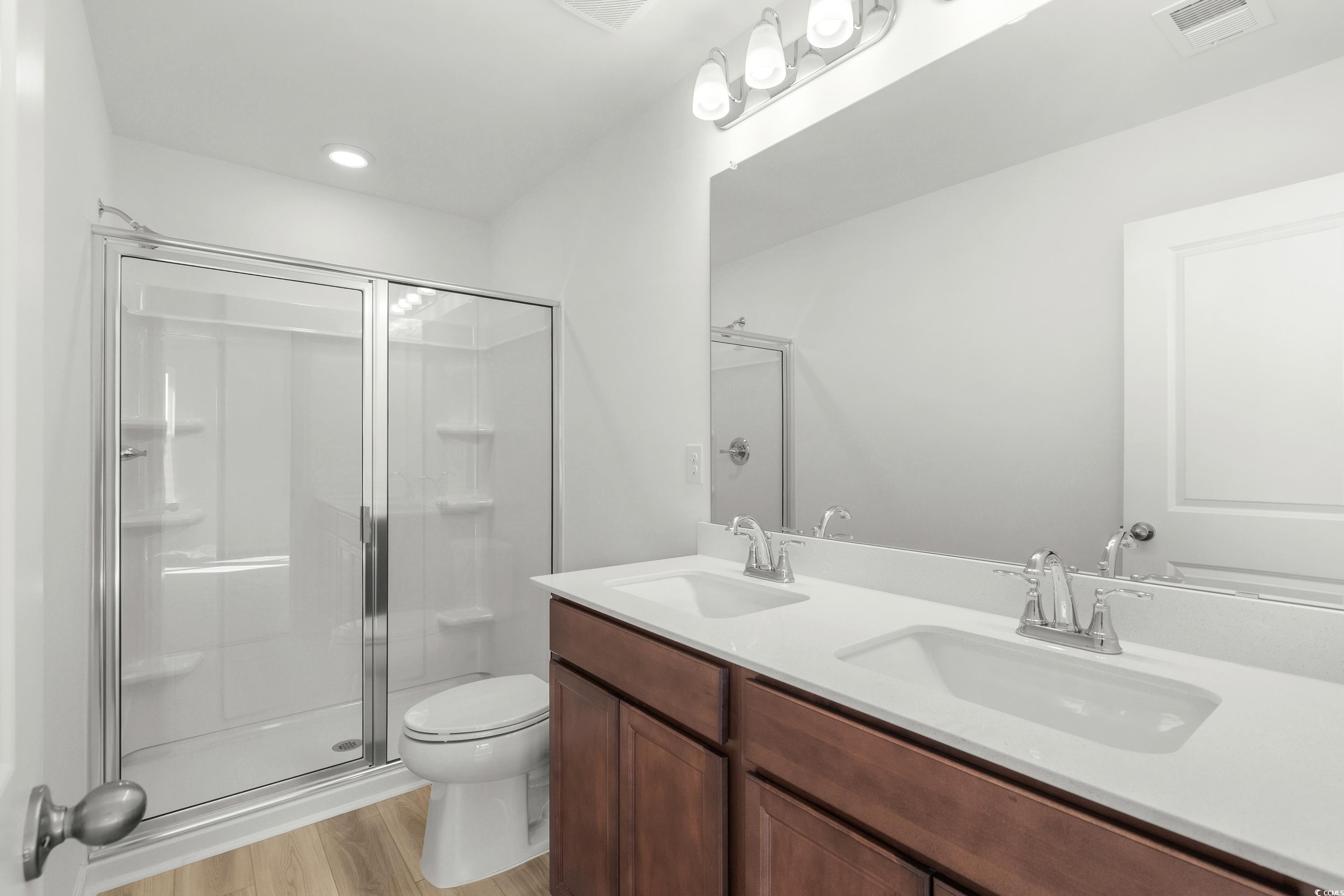 4414 Kingsport Road, Unit 1502 Little River, SC 29566 - Photo 16 of 33 Unfurnished bedroom featuring light carpet and connected bathroom