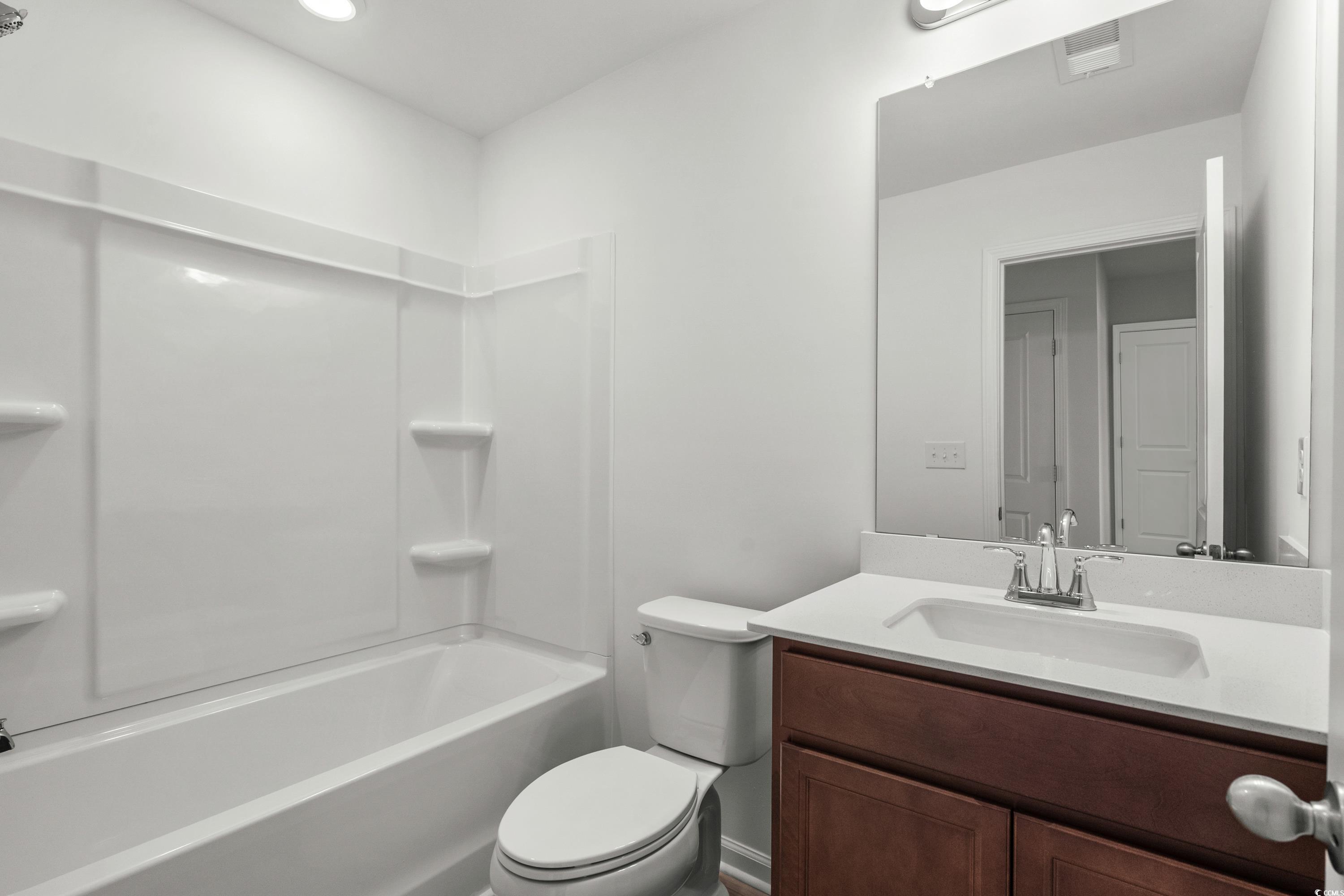 4414 Kingsport Road, Unit 1502 Little River, SC 29566 - Photo 21 of 33 Unfurnished bedroom with carpet flooring and baseboards