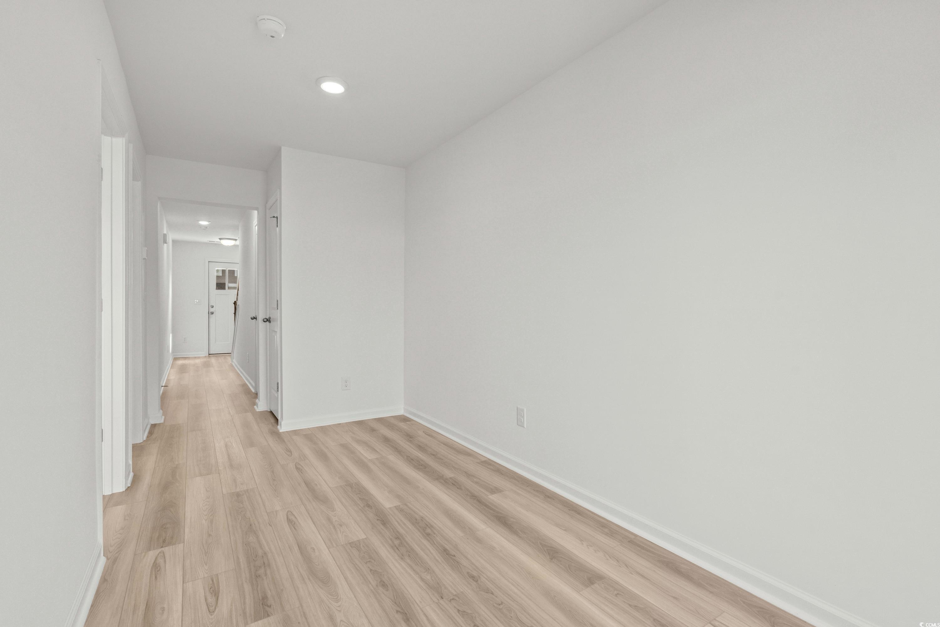 4414 Kingsport Road, Unit 1502 Little River, SC 29566 - Photo 23 of 33 Unfurnished room with light wood finished floors and recessed lighting