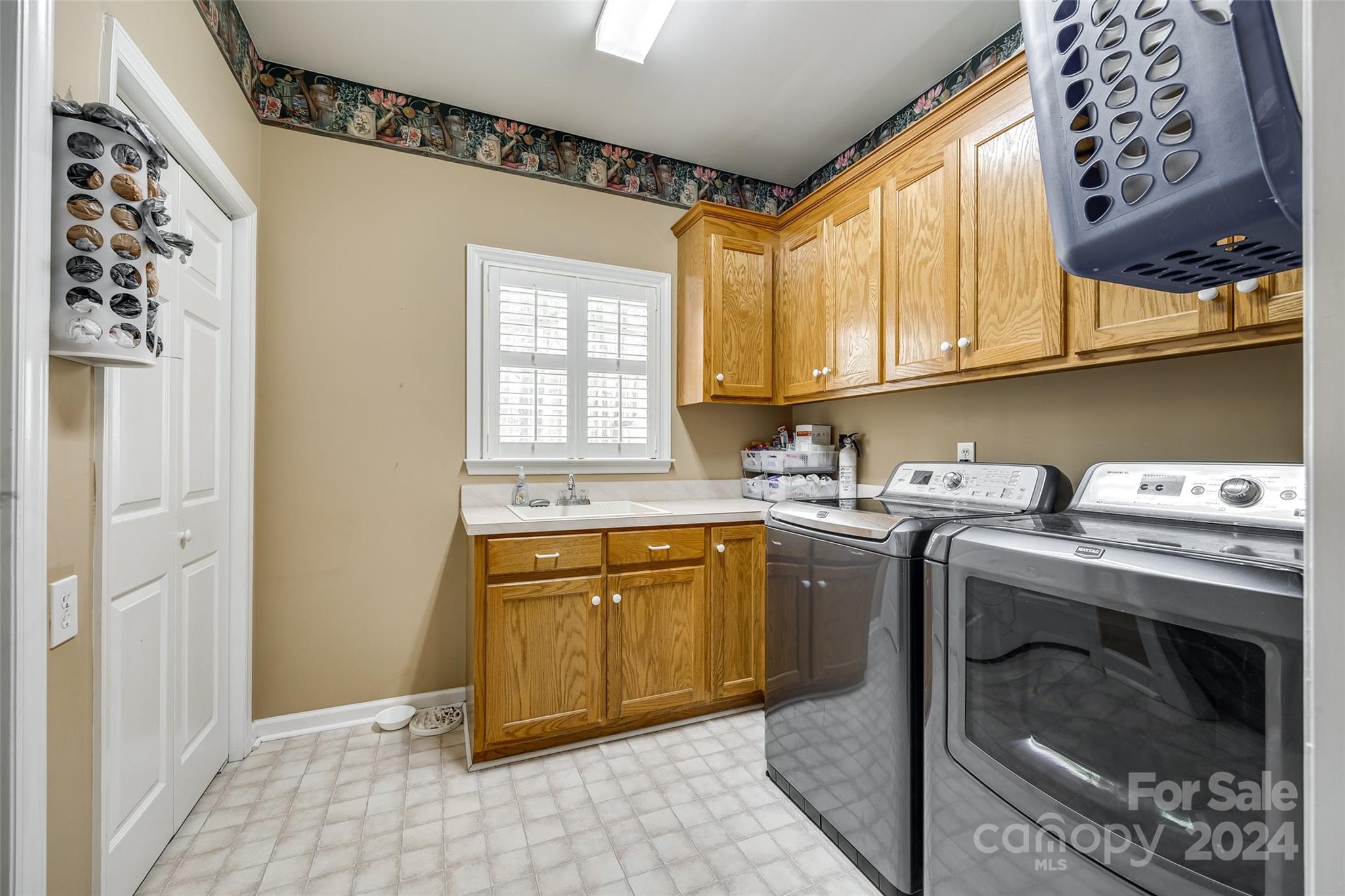 9999 Jim Sossoman Road Midland, NC 28107 - Photo 15 of 43 a kitchen with a sink stove and cabinets