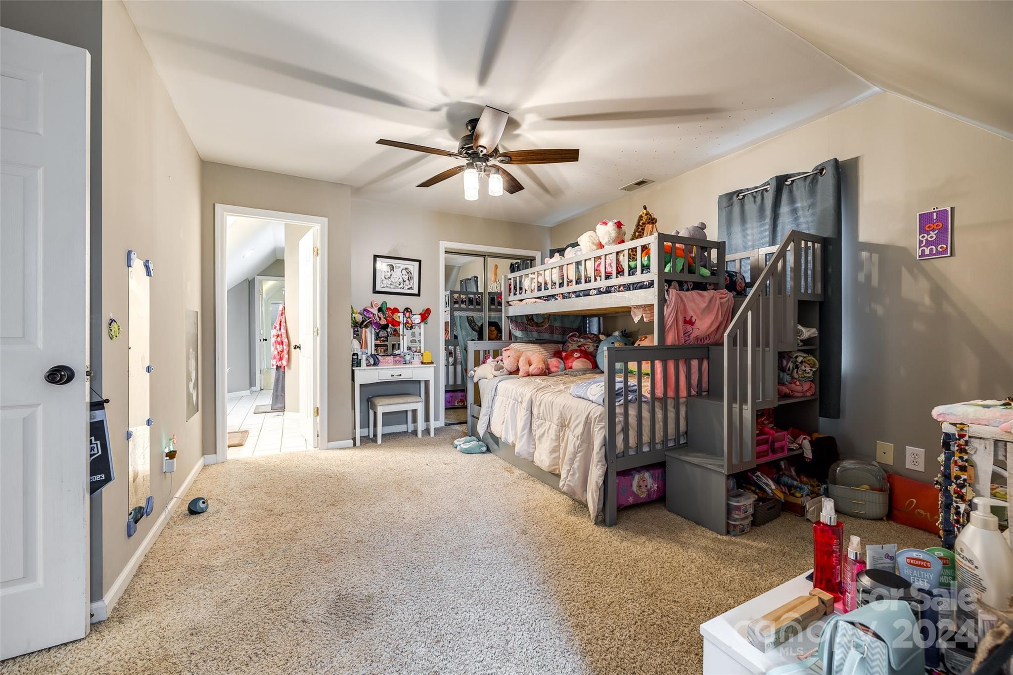 9999 Jim Sossoman Road Midland, NC 28107 - Photo 26 of 43 a bedroom with furniture and a chandelier