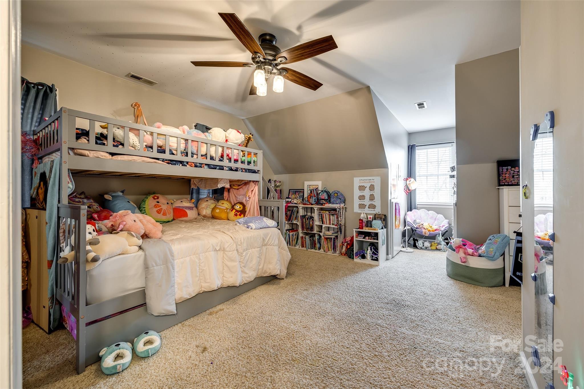 9999 Jim Sossoman Road Midland, NC 28107 - Photo 27 of 43 a bed room with a bed and a large window