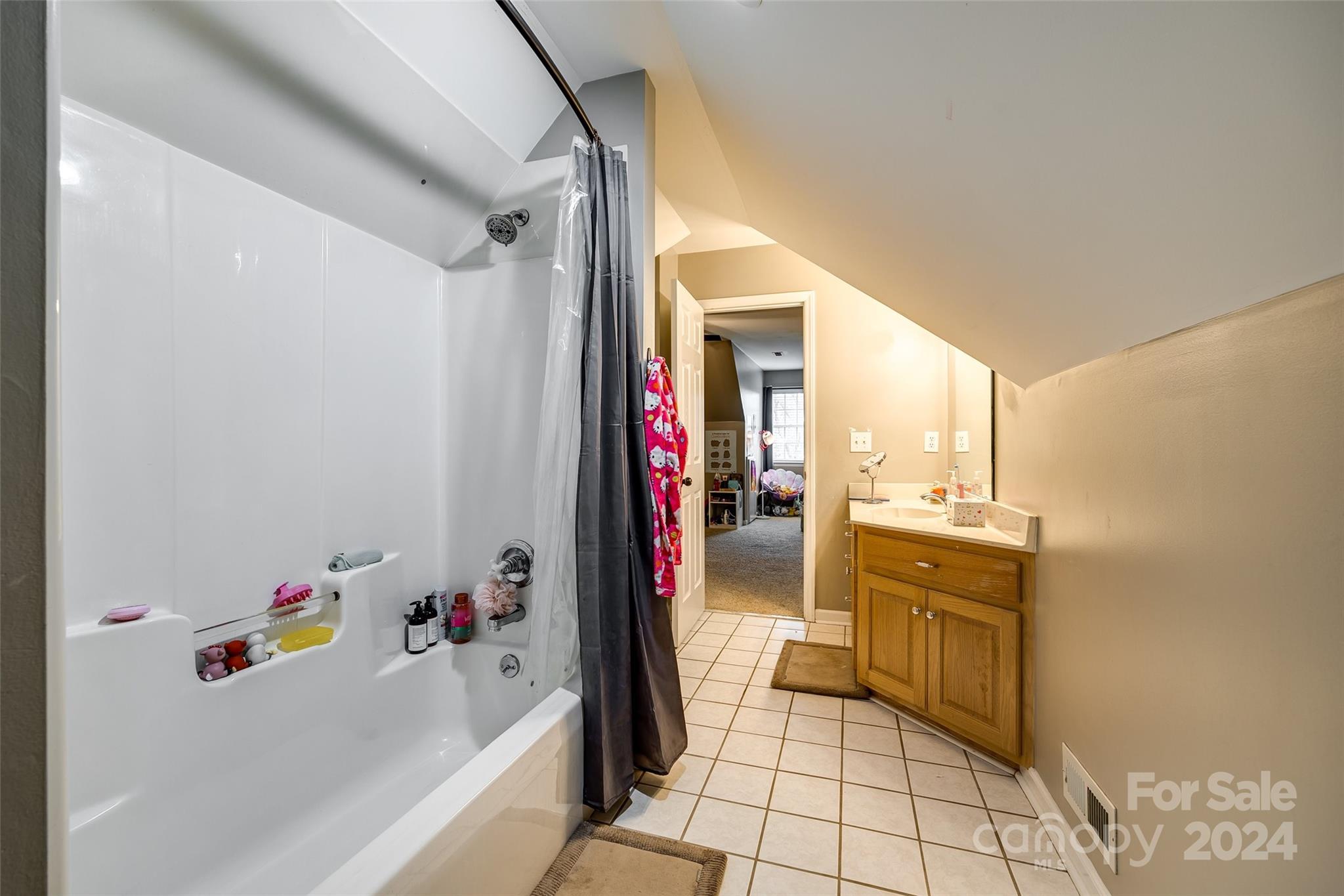 9999 Jim Sossoman Road Midland, NC 28107 - Photo 28 of 43 a bathroom with a tub a sink and a window