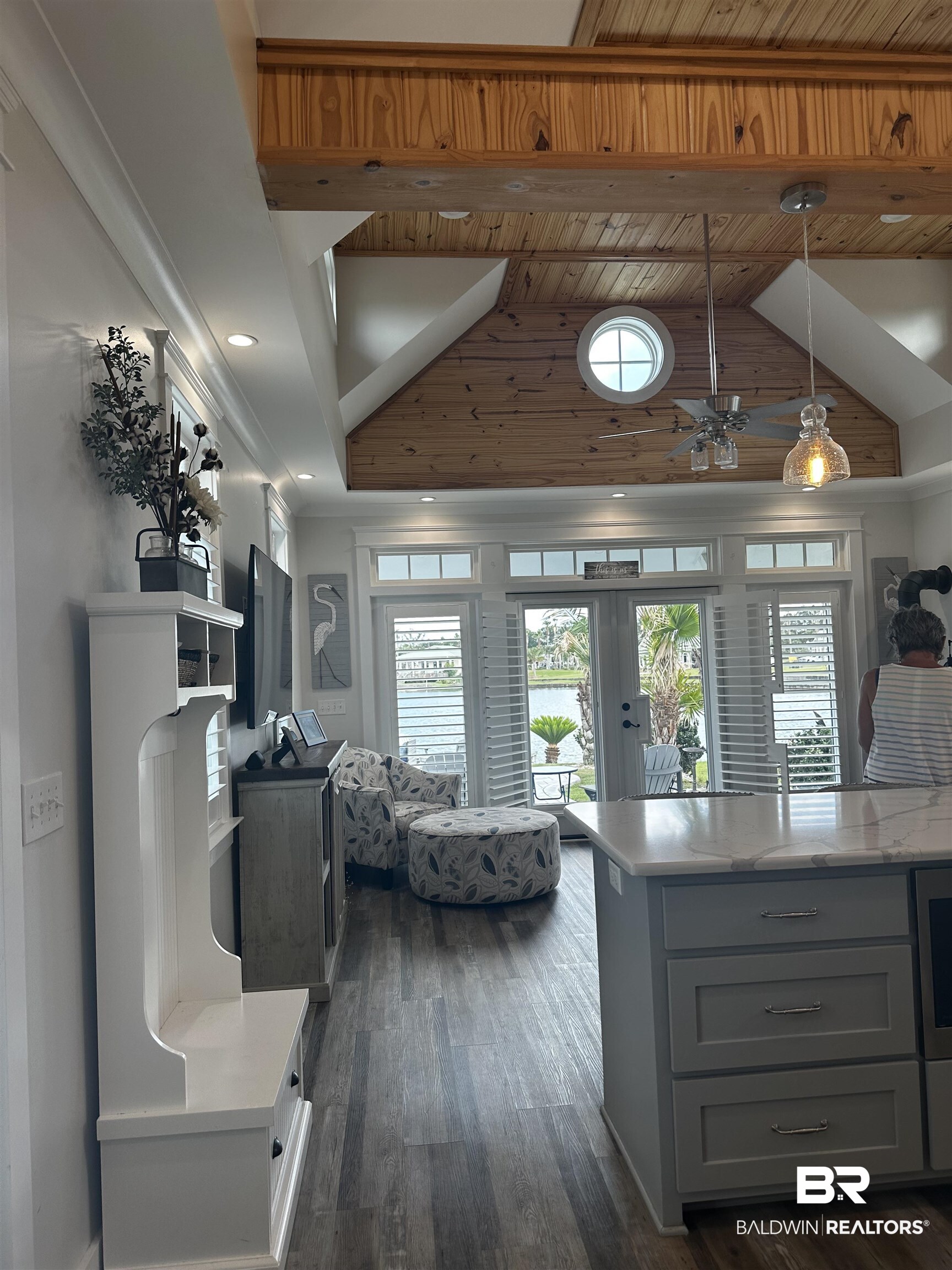 28058 Migratory Way, Unit 100 Elberta, AL 36530 - Photo 40 of 83 Kitchen featuring decorative light fixtures, high vaulted ceiling, dark wood-type flooring, and gray cabinets