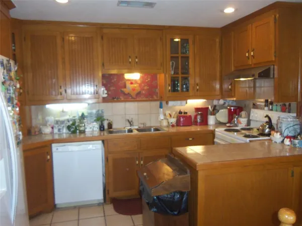 a view of a dining room with furniture a chandelier and wooden floor
