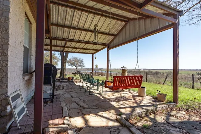 a view of a house with a yard and garage