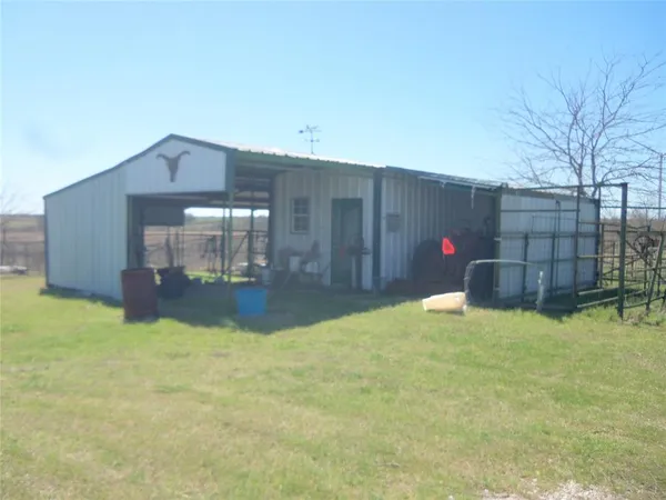 a view of a house with a yard and garage