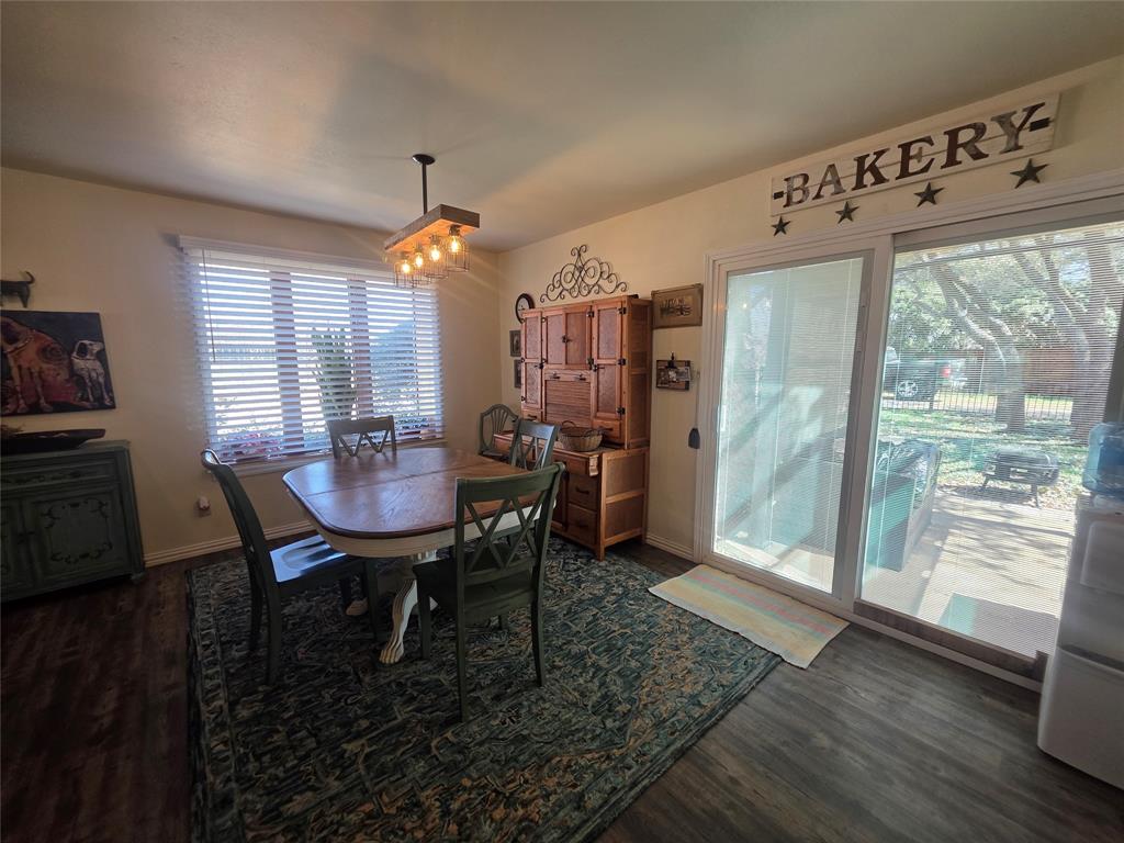 1301 Cliff Drive Graham, TX 76450 - Photo 13 of 38 a view of a dining room with furniture window and wooden floor