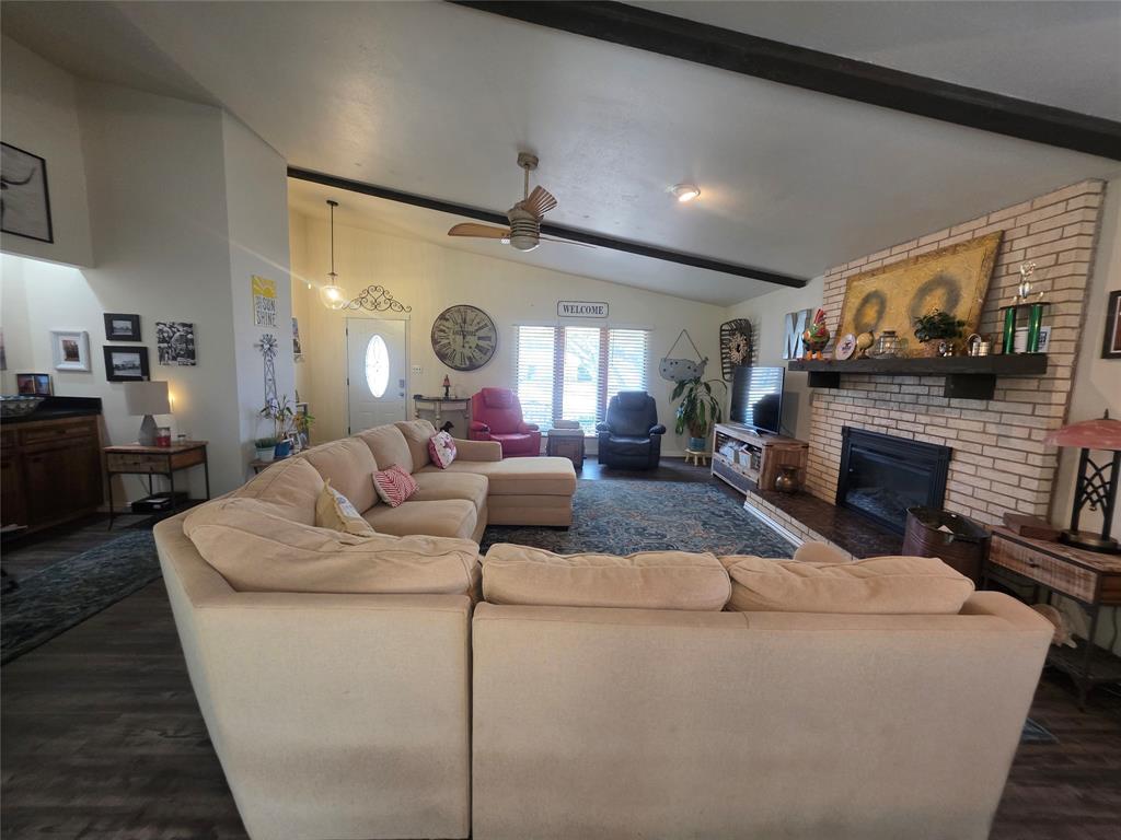 1301 Cliff Drive Graham, TX 76450 - Photo 14 of 38 a living room with furniture and a fireplace