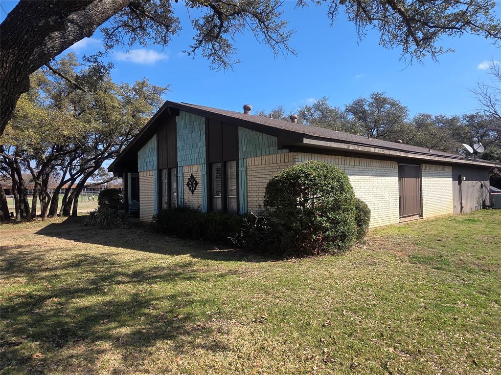 1301 Cliff Drive Graham, TX 76450 - Photo 2 of 38 a view of a house with a yard