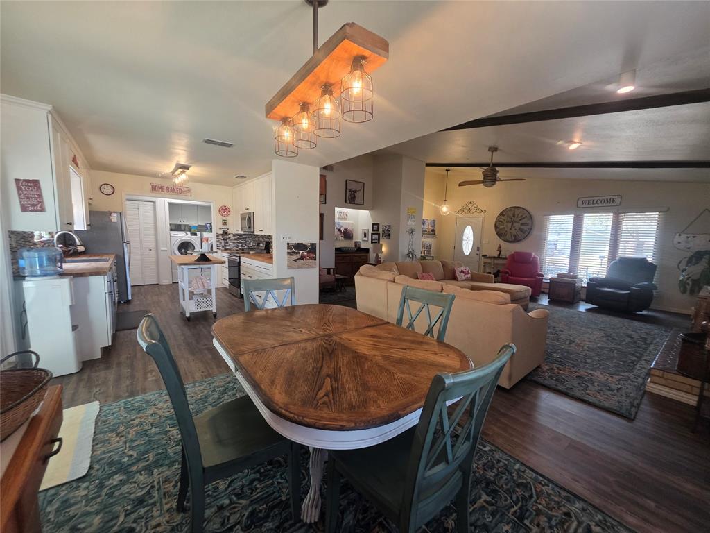 1301 Cliff Drive Graham, TX 76450 - Photo 22 of 38 a view of a dining room with furniture and wooden floor