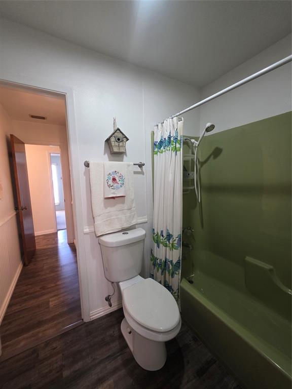 1301 Cliff Drive Graham, TX 76450 - Photo 24 of 38 a bathroom with a toilet a sink and shower