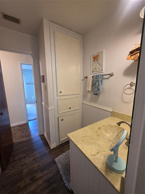 1301 Cliff Drive Graham, TX 76450 - Photo 28 of 38 a bathroom with a sink a mirror and shower