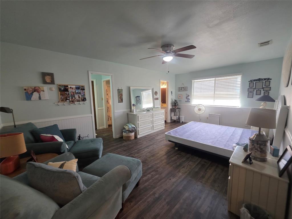 1301 Cliff Drive Graham, TX 76450 - Photo 30 of 38 a bedroom with furniture and a wooden floor