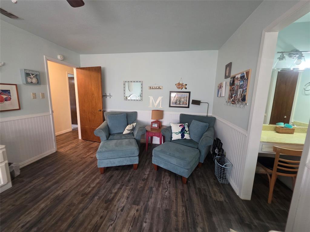 1301 Cliff Drive Graham, TX 76450 - Photo 31 of 38 a living room with furniture and a wooden floor