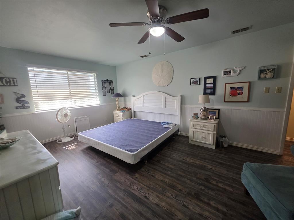 1301 Cliff Drive Graham, TX 76450 - Photo 38 of 38 a bedroom with a bed and a chandelier
