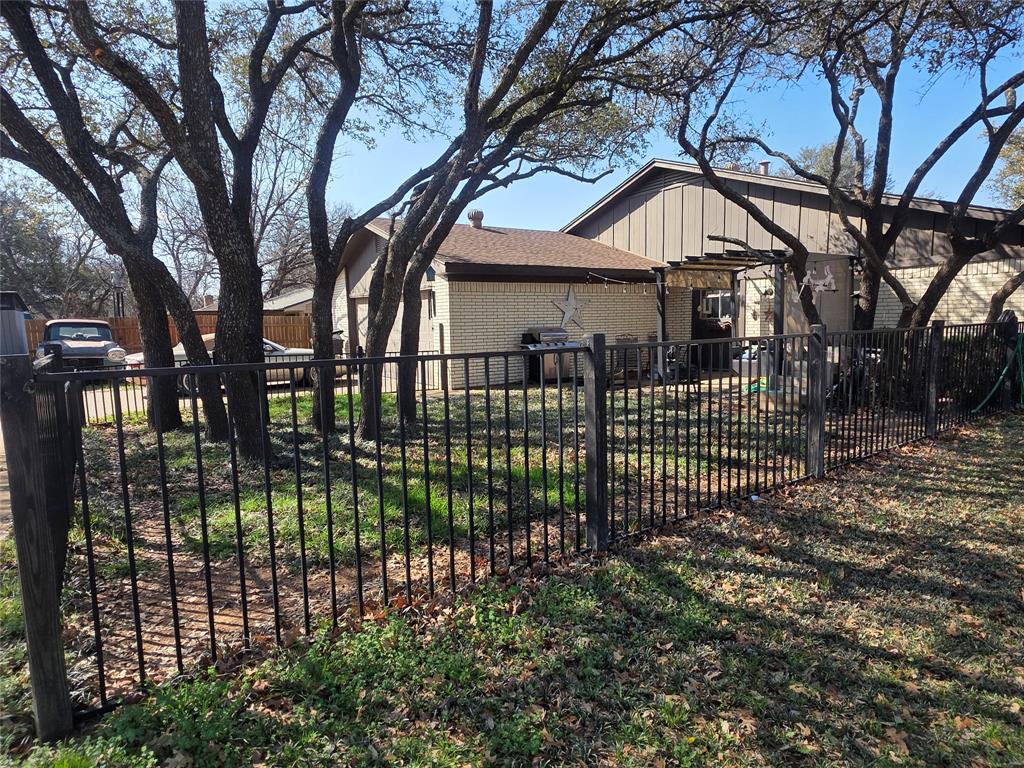 1301 Cliff Drive Graham, TX 76450 - Photo 6 of 38 a view of a house with a small yard and a large tree
