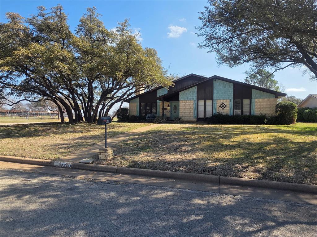 1301 Cliff Drive Graham, TX 76450 - Photo 8 of 38 a big yard with large trees