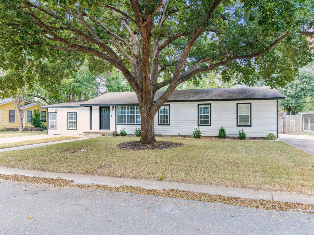 a house with trees in front of it