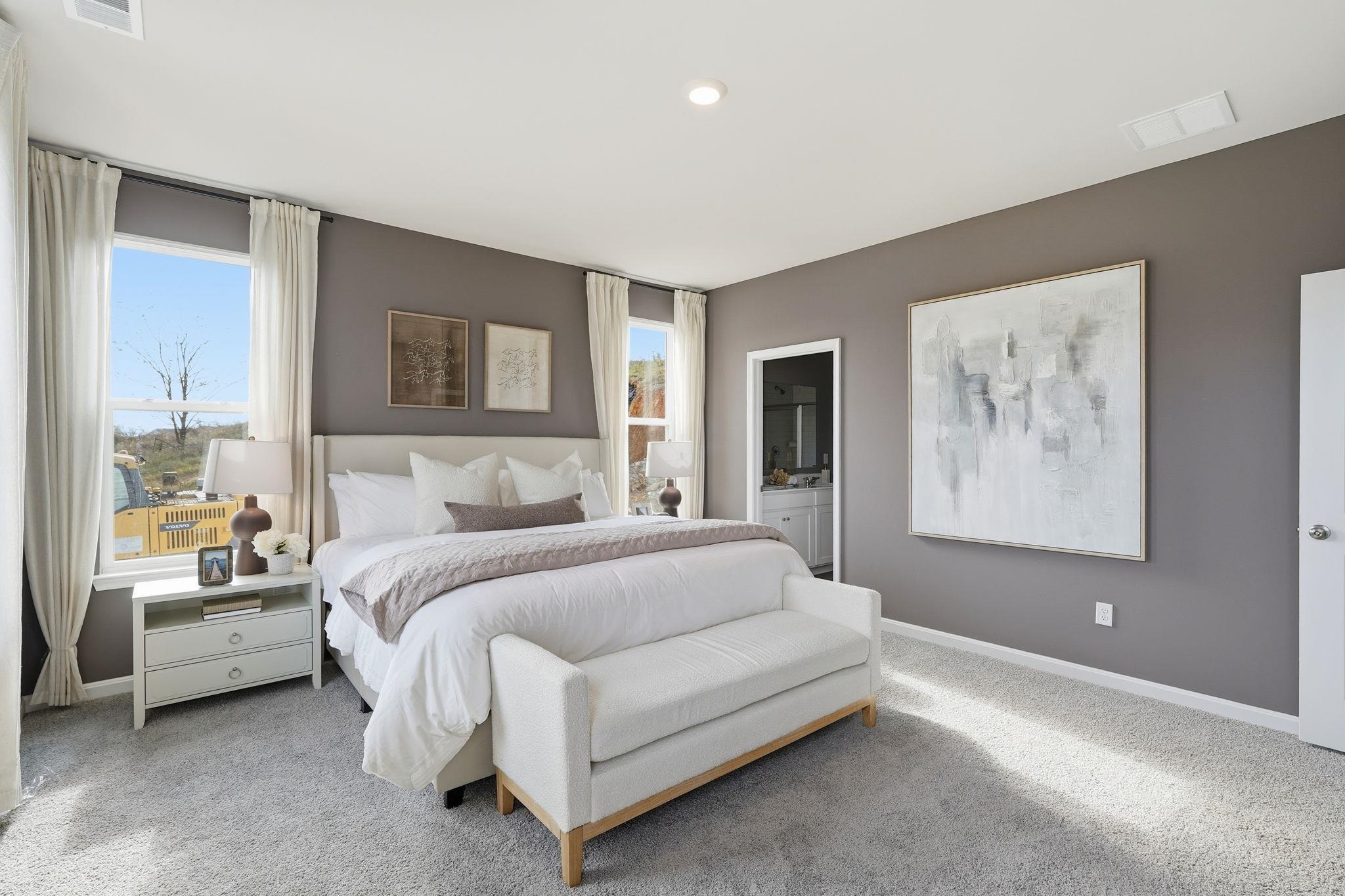 105 Jillian Lane Penn Laird, VA 22846 - Photo 22 of 35 a spacious bedroom with a bed and a couch