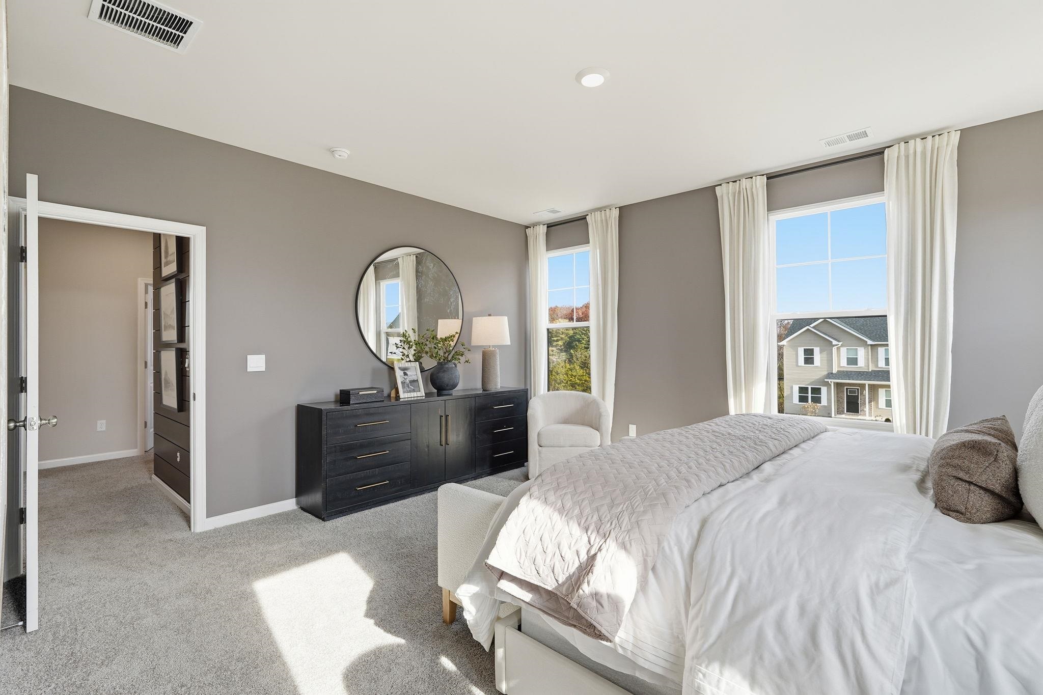 105 Jillian Lane Penn Laird, VA 22846 - Photo 24 of 35 a bedroom with a bed and a chandelier