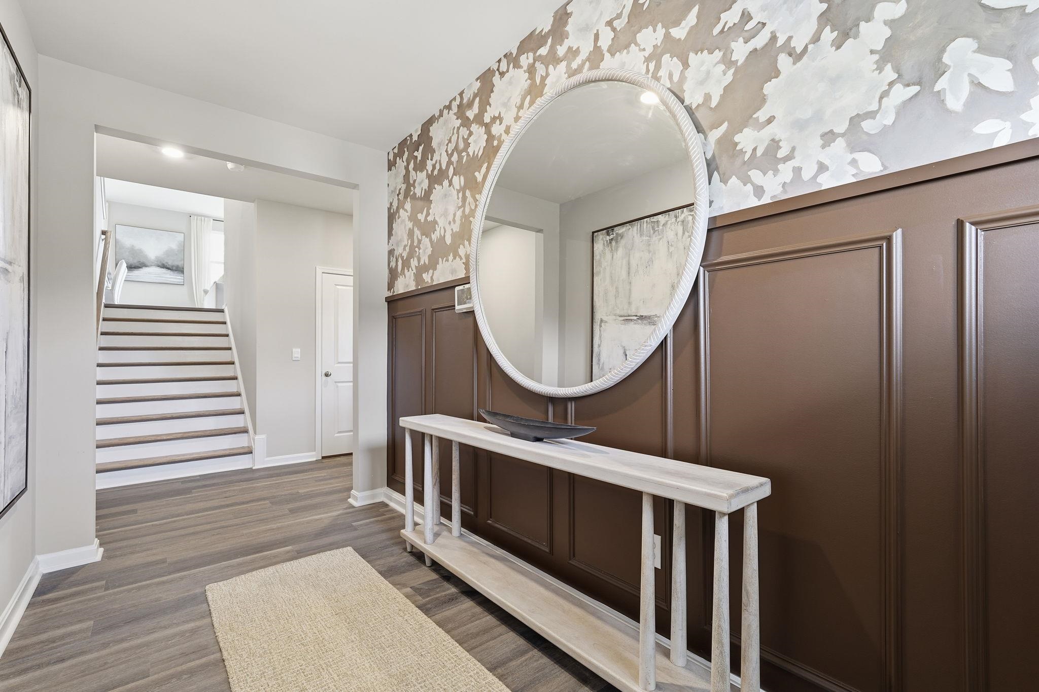 105 Jillian Lane Penn Laird, VA 22846 - Photo 3 of 35 a living room with furniture a mirror and a wooden floor