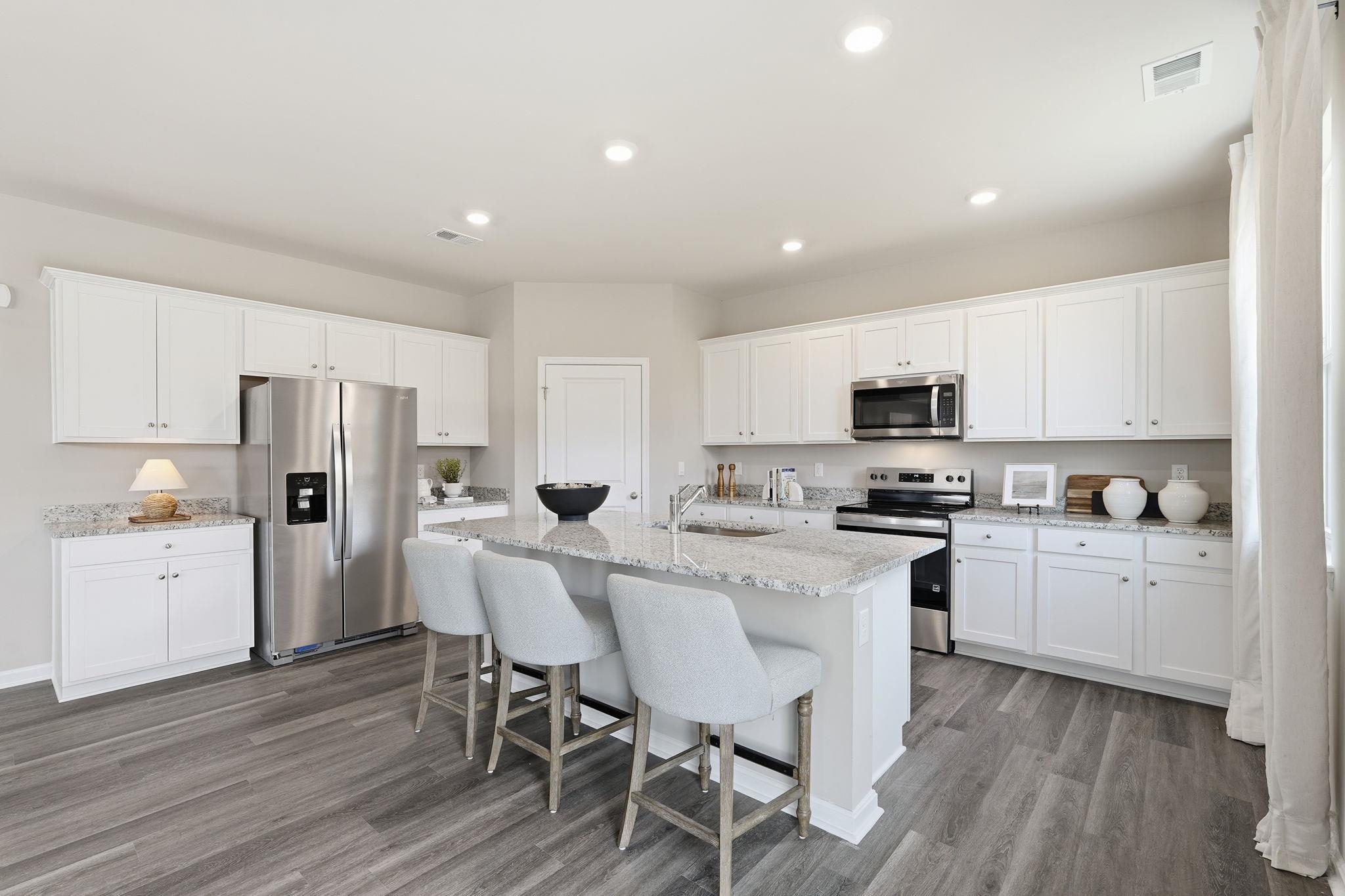 105 Jillian Lane Penn Laird, VA 22846 - Photo 5 of 35 a kitchen with white cabinets and stainless steel appliances