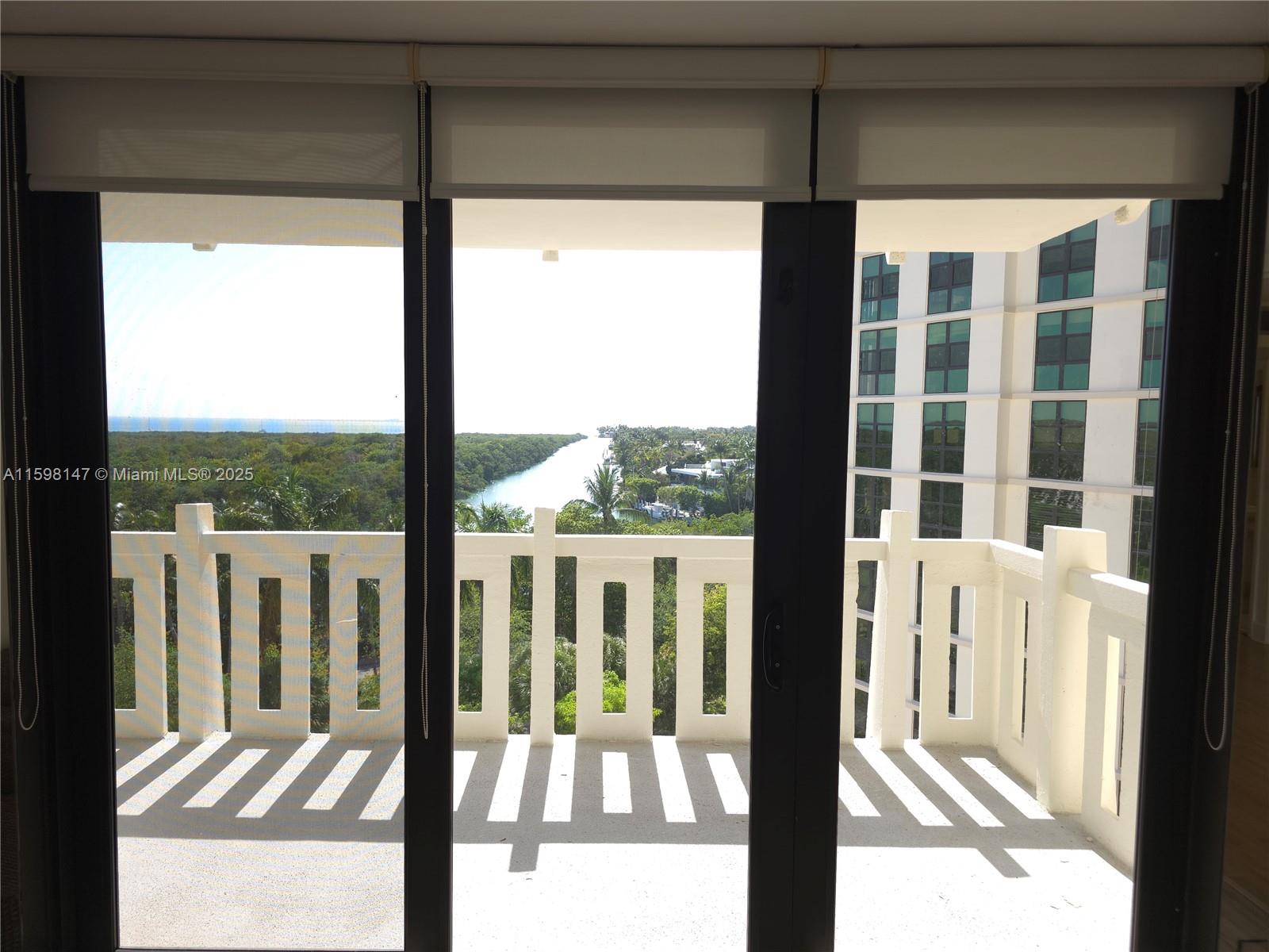 1121 Crandon Boulevard, Unit D604 Key Biscayne, FL 33149 - Photo 11 of 31 a view of a balcony with wooden floor
