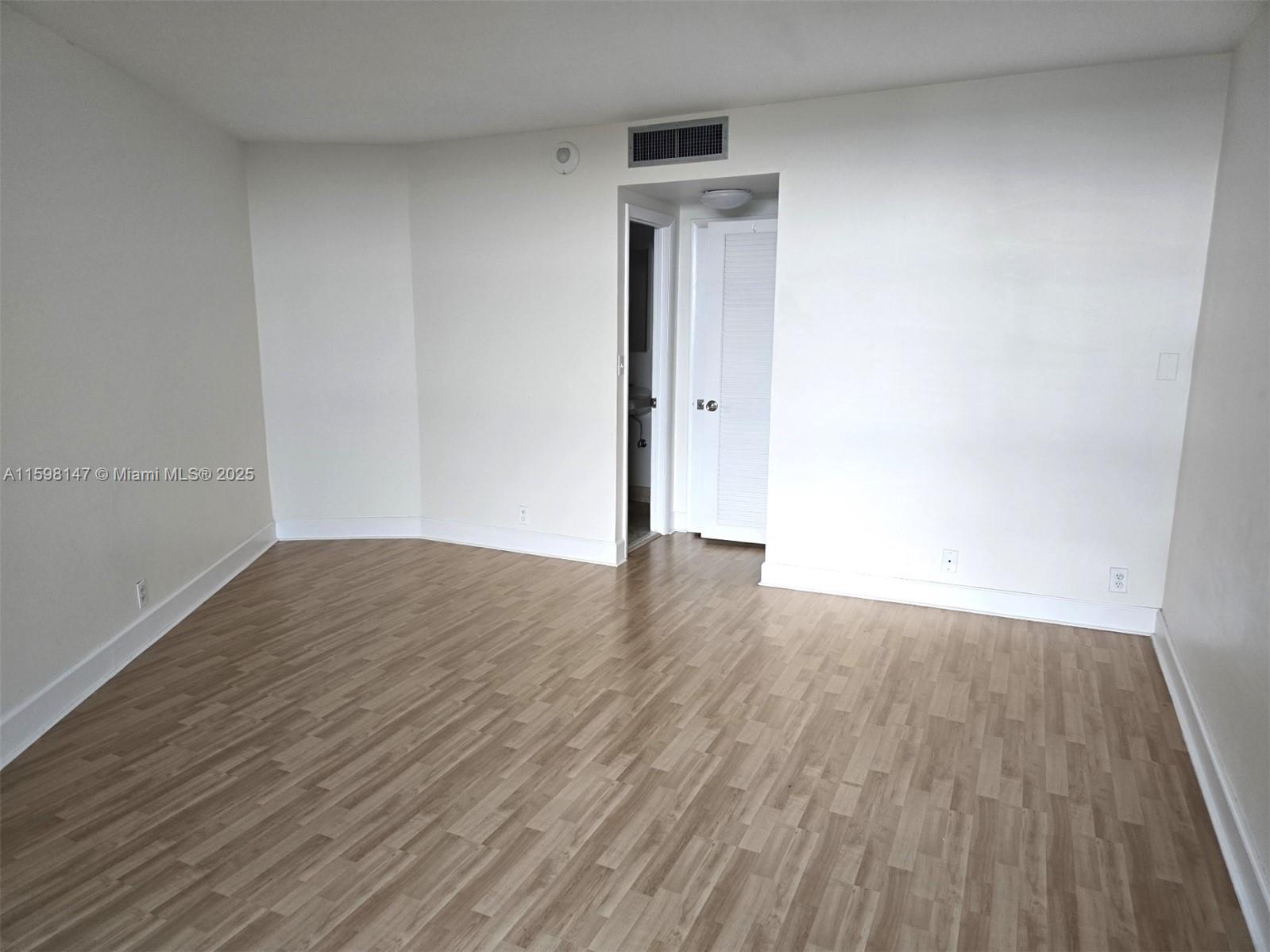 1121 Crandon Boulevard, Unit D604 Key Biscayne, FL 33149 - Photo 15 of 31 a view of wooden floor in an empty room