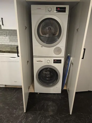a utility room with dryer and washer