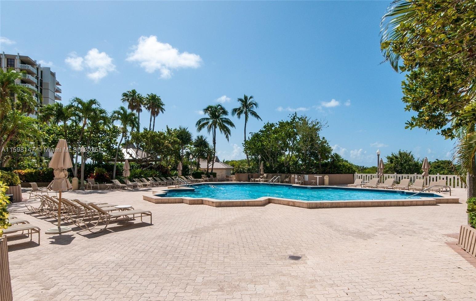 1121 Crandon Boulevard, Unit D604 Key Biscayne, FL 33149 - Photo 27 of 31 a view of outdoor space yard and swimming pool