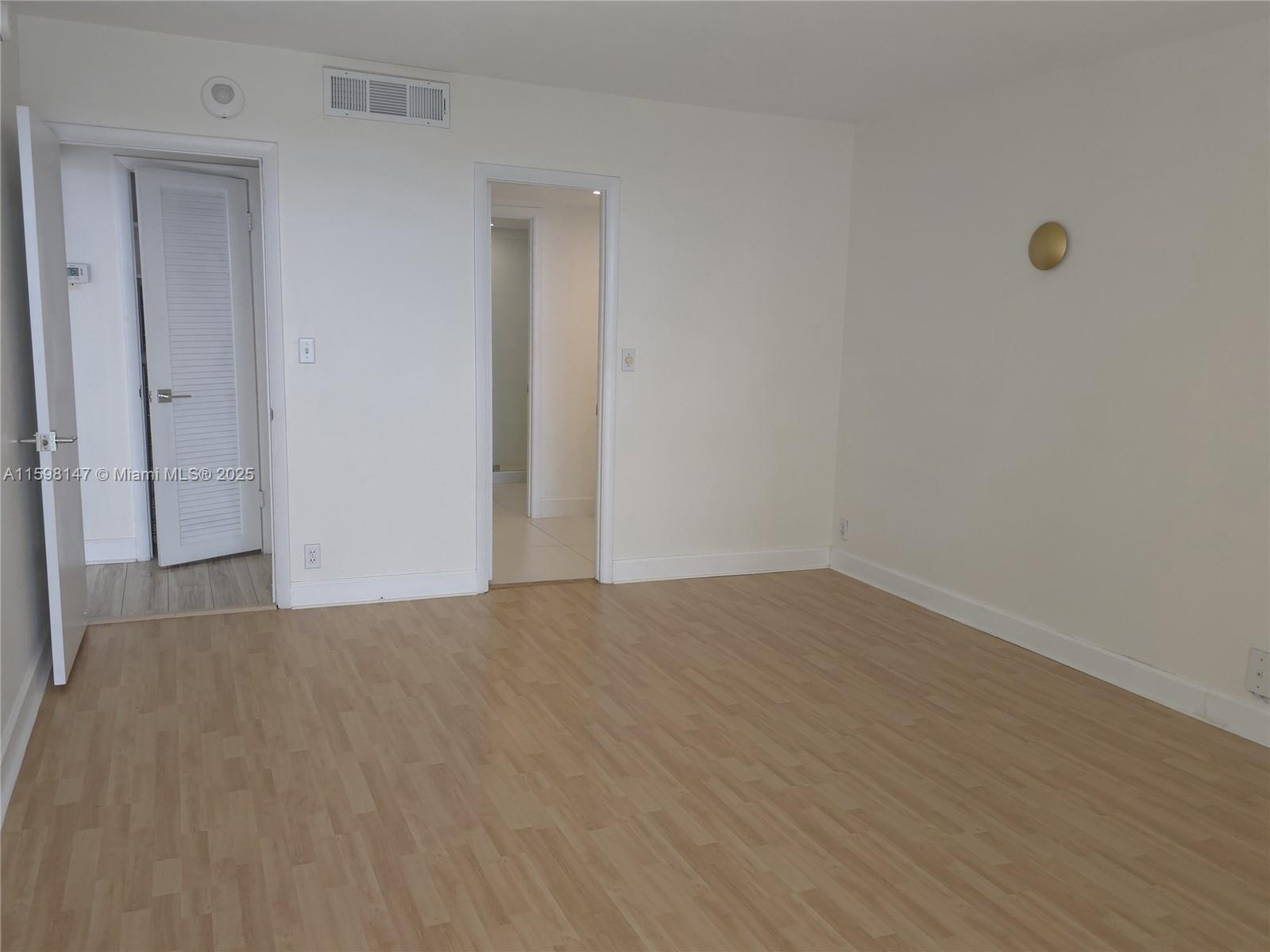 1121 Crandon Boulevard, Unit D604 Key Biscayne, FL 33149 - Photo 10 of 31 a view of an empty room and wooden floor