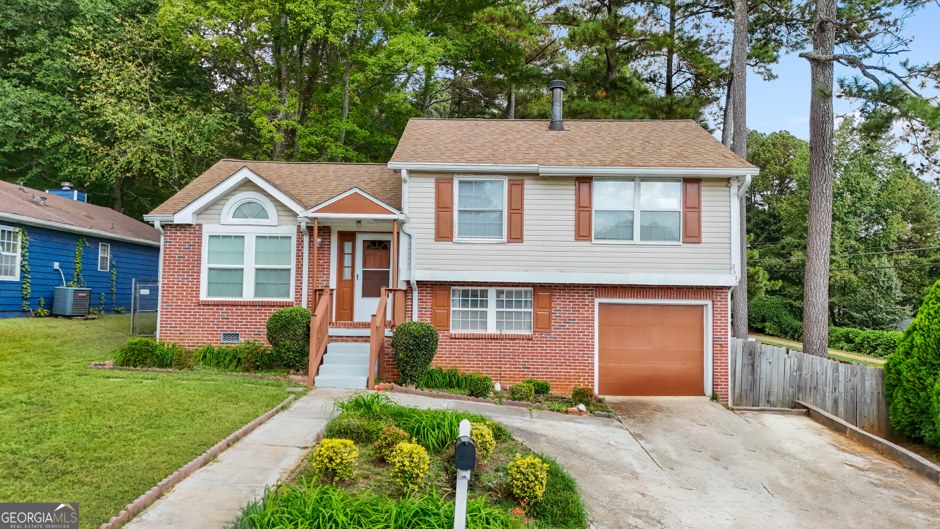 2332 Wilkins Court Decatur, GA 30035 - Photo 1 of 1 a front view of a house with garden