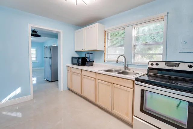 a kitchen with sink and window