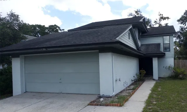 a house with trees in the background