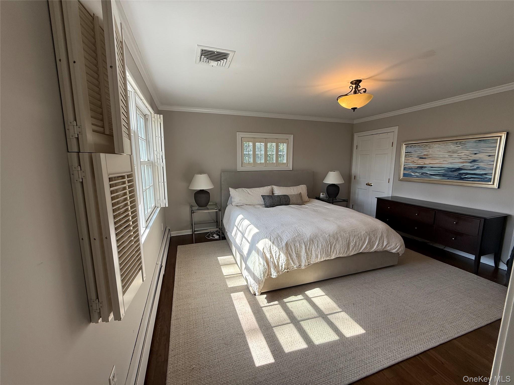 21 Westbank Road Rye, NY 10580 - Photo 15 of 32 a bedroom with a bed and a walk in closet
