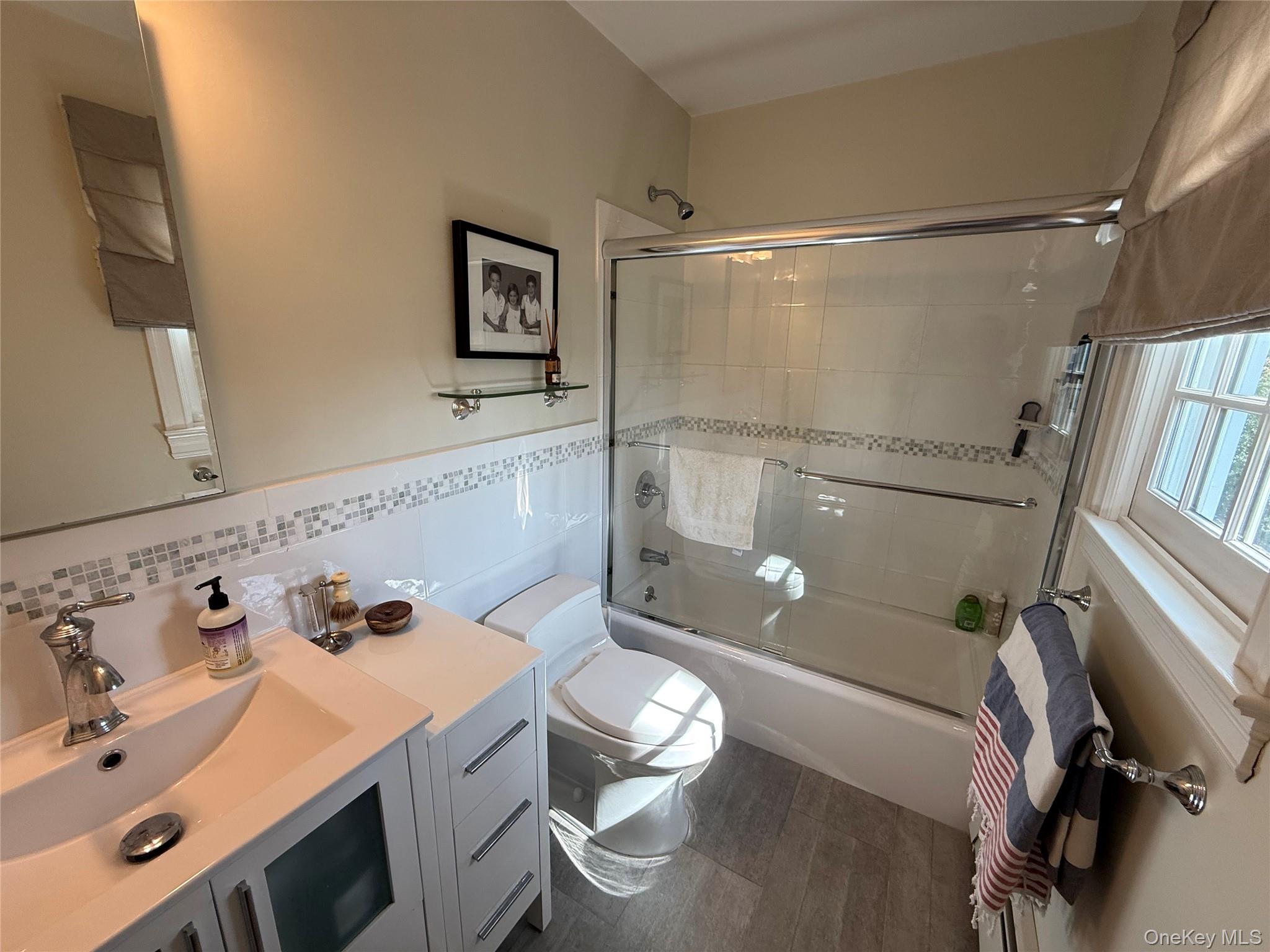 21 Westbank Road Rye, NY 10580 - Photo 16 of 32 a bathroom with a sink a toilet and shower
