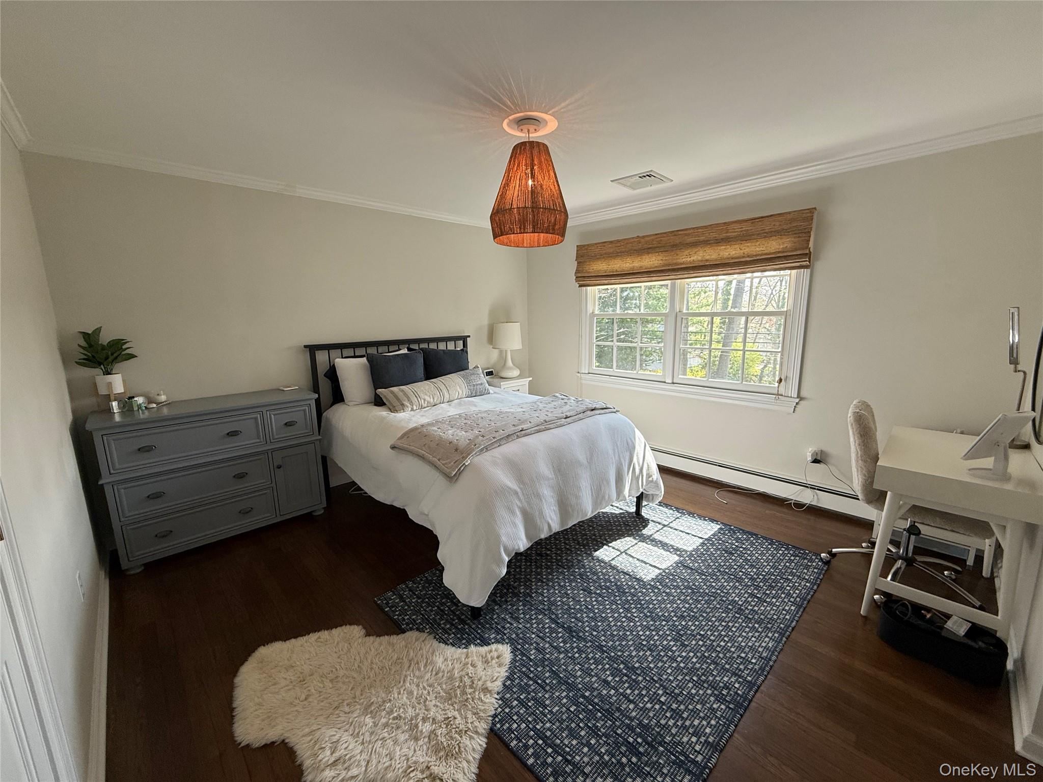 21 Westbank Road Rye, NY 10580 - Photo 19 of 32 a bedroom with a bed and wooden floor