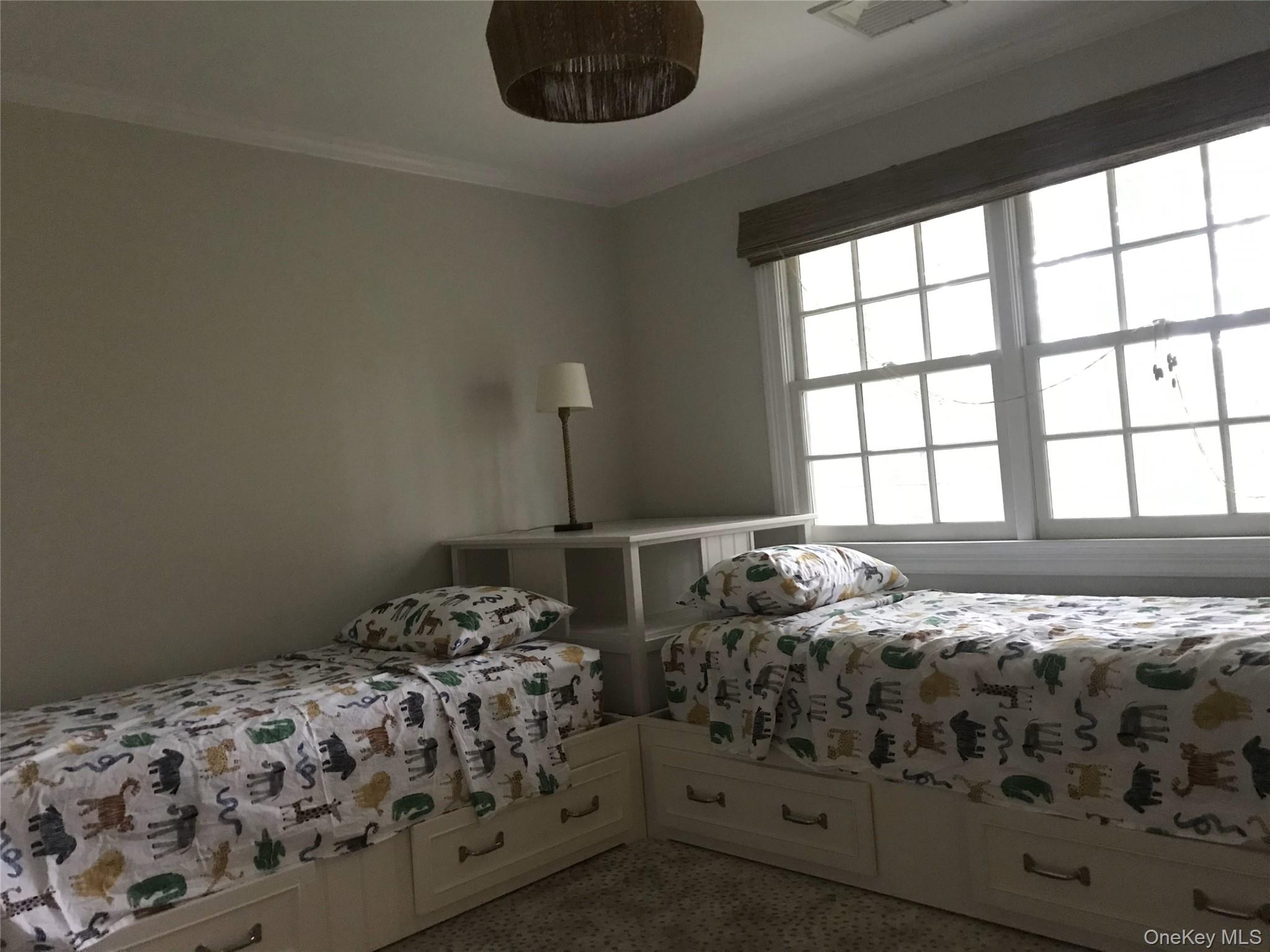 21 Westbank Road Rye, NY 10580 - Photo 20 of 32 a bedroom with two beds next to a window