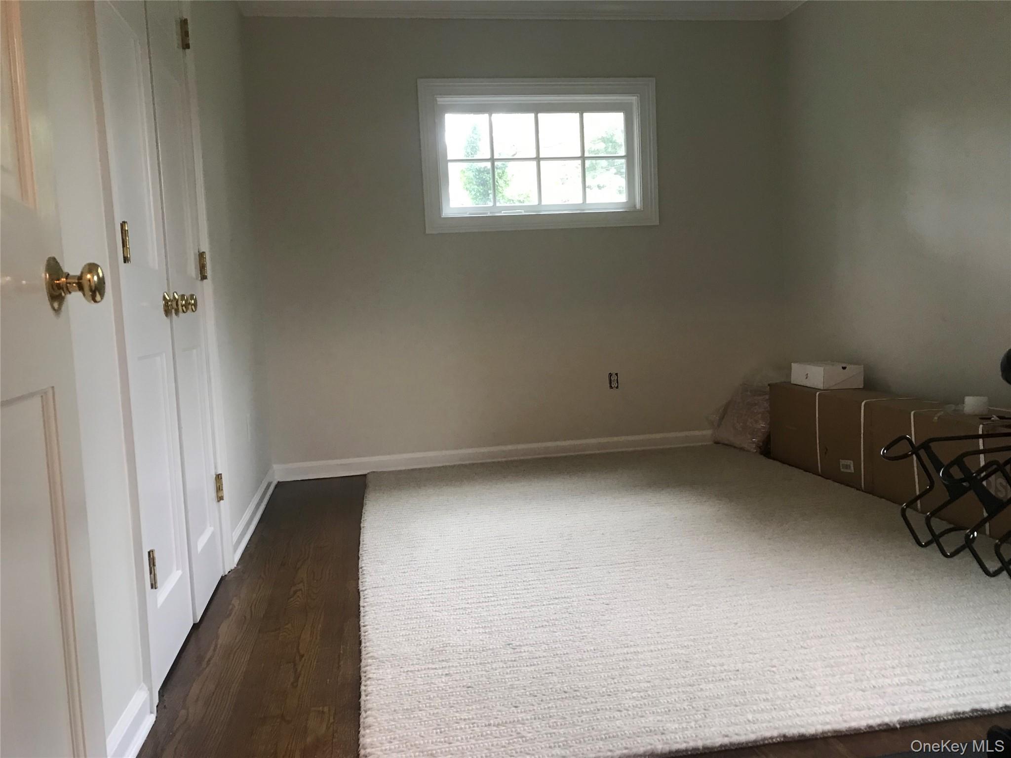 21 Westbank Road Rye, NY 10580 - Photo 23 of 32 a view of a room with rack on the wall and a window
