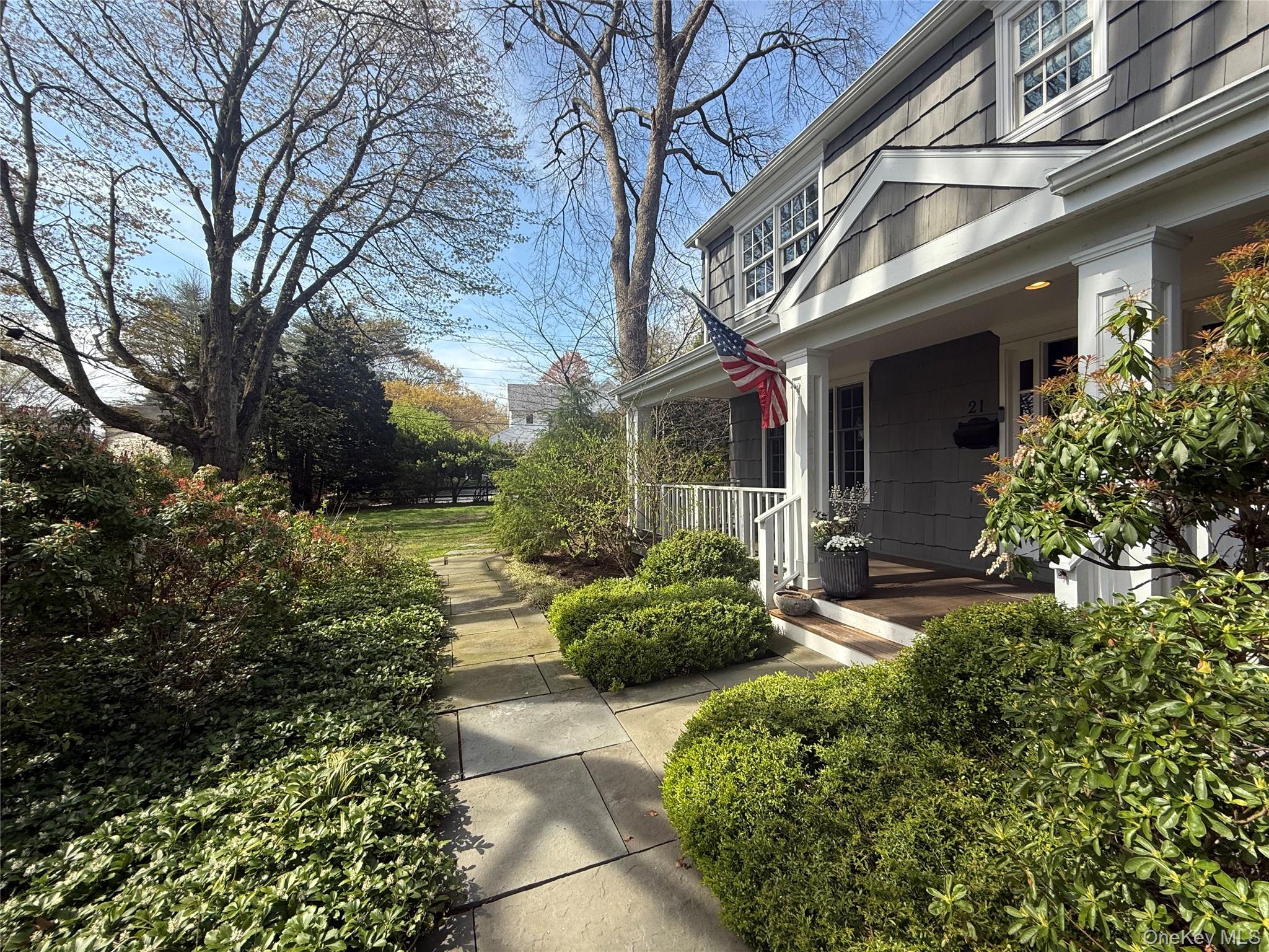 21 Westbank Road Rye, NY 10580 - Photo 24 of 32 a front view of a house with a yard