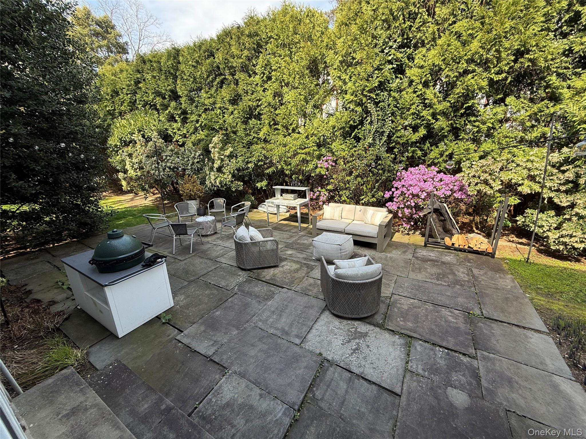 21 Westbank Road Rye, NY 10580 - Photo 28 of 32 a view of a backyard with furniture and potted plants