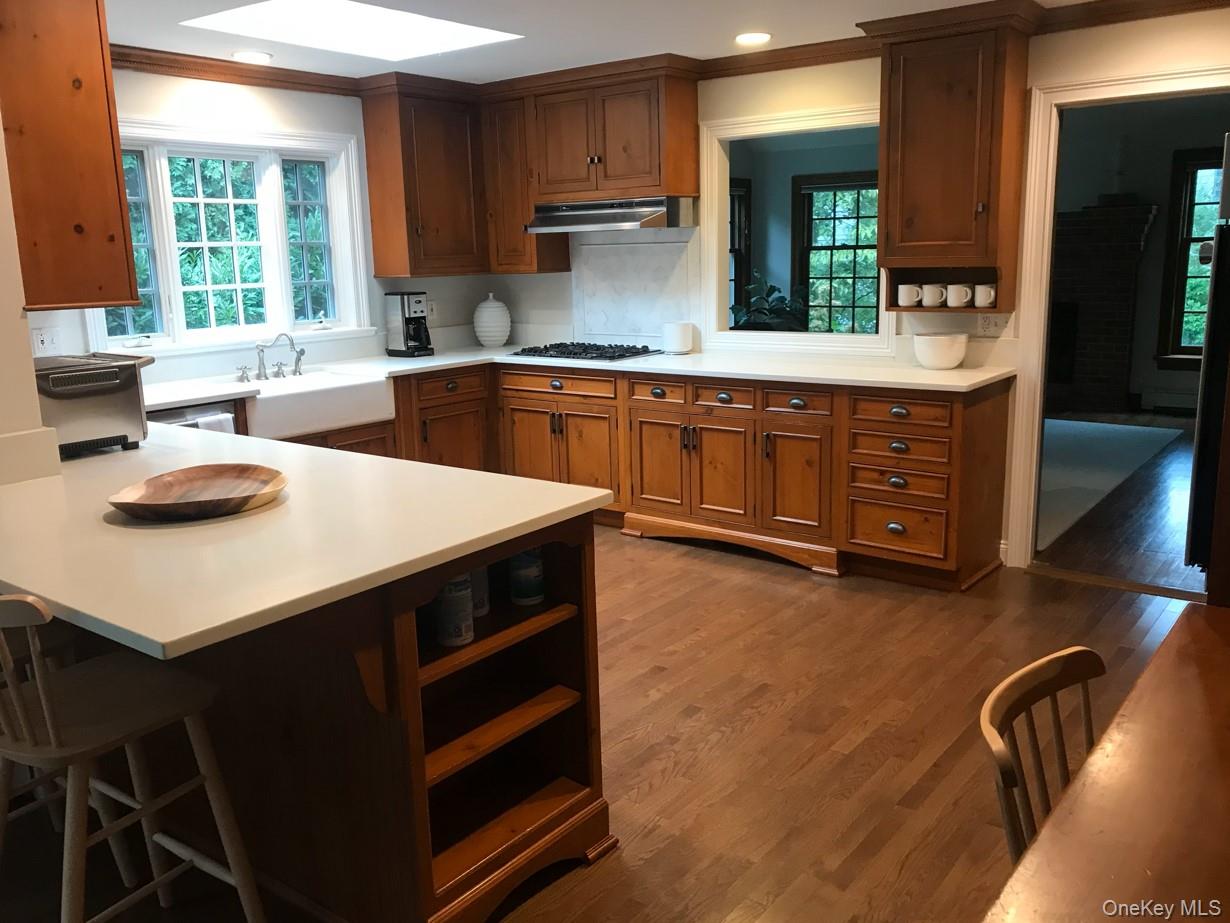 21 Westbank Road Rye, NY 10580 - Photo 4 of 32 a kitchen with a sink a stove and cabinets