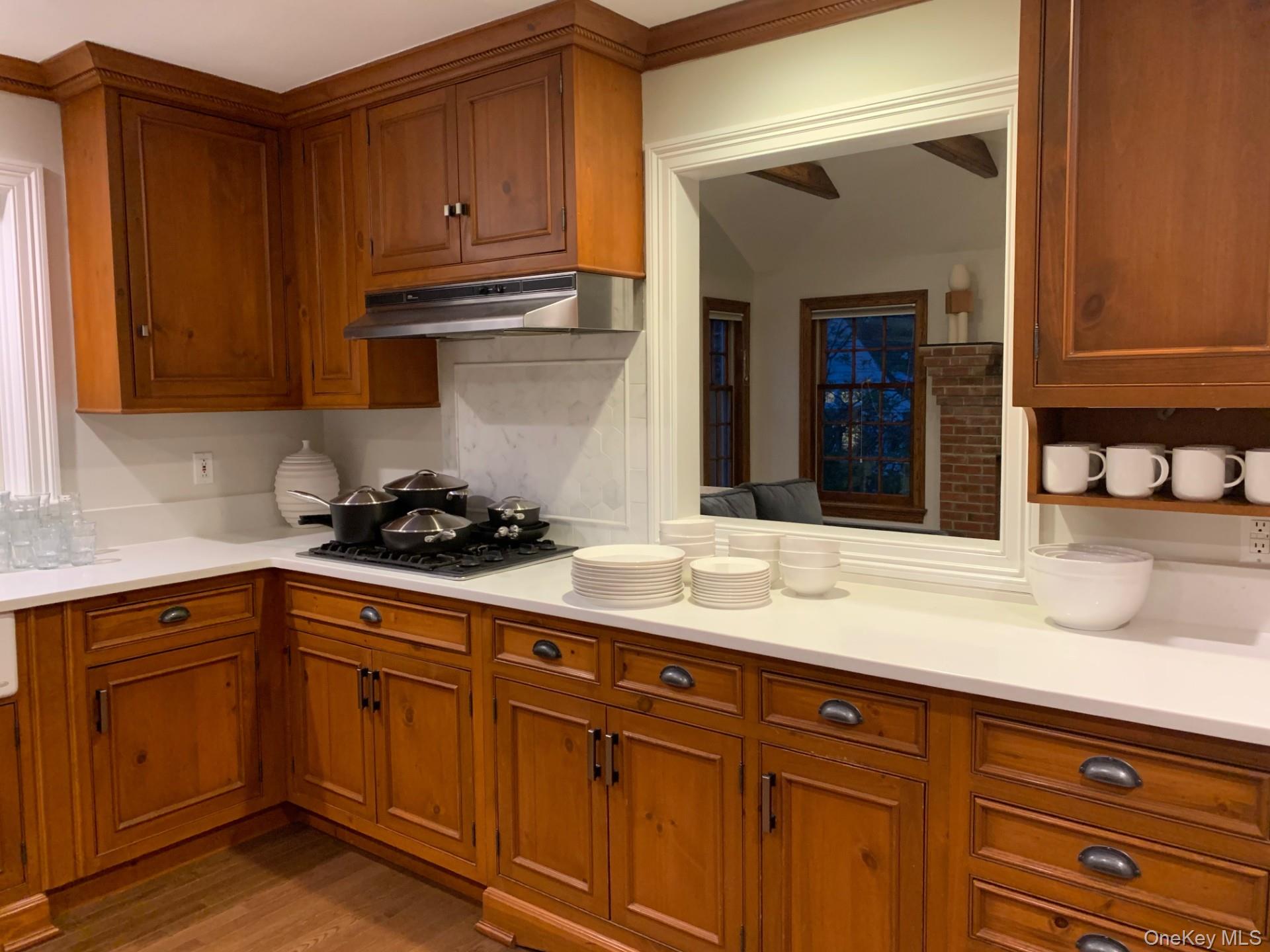 21 Westbank Road Rye, NY 10580 - Photo 6 of 32 a kitchen with granite countertop a sink cabinets and stainless steel appliances